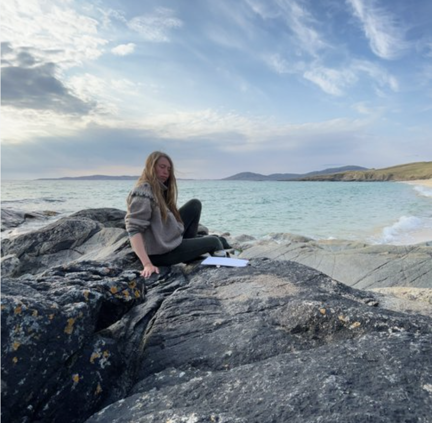 Artist Ellis O'Connor painting during a women's art retreat on the Isle of Harris, Outer Hebrides