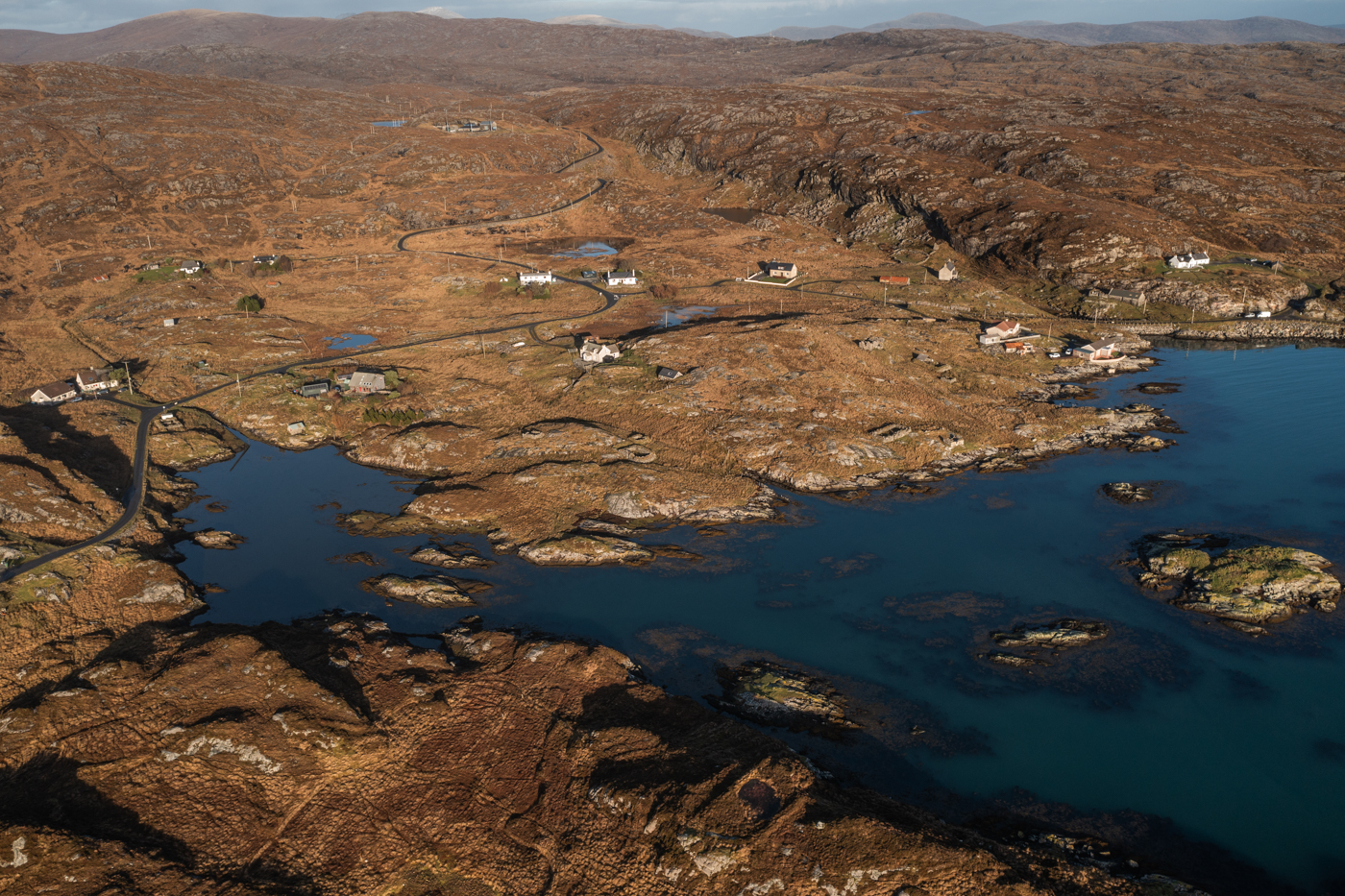 aerial view over the bays of harris with rocky inlets and an art gallery 
