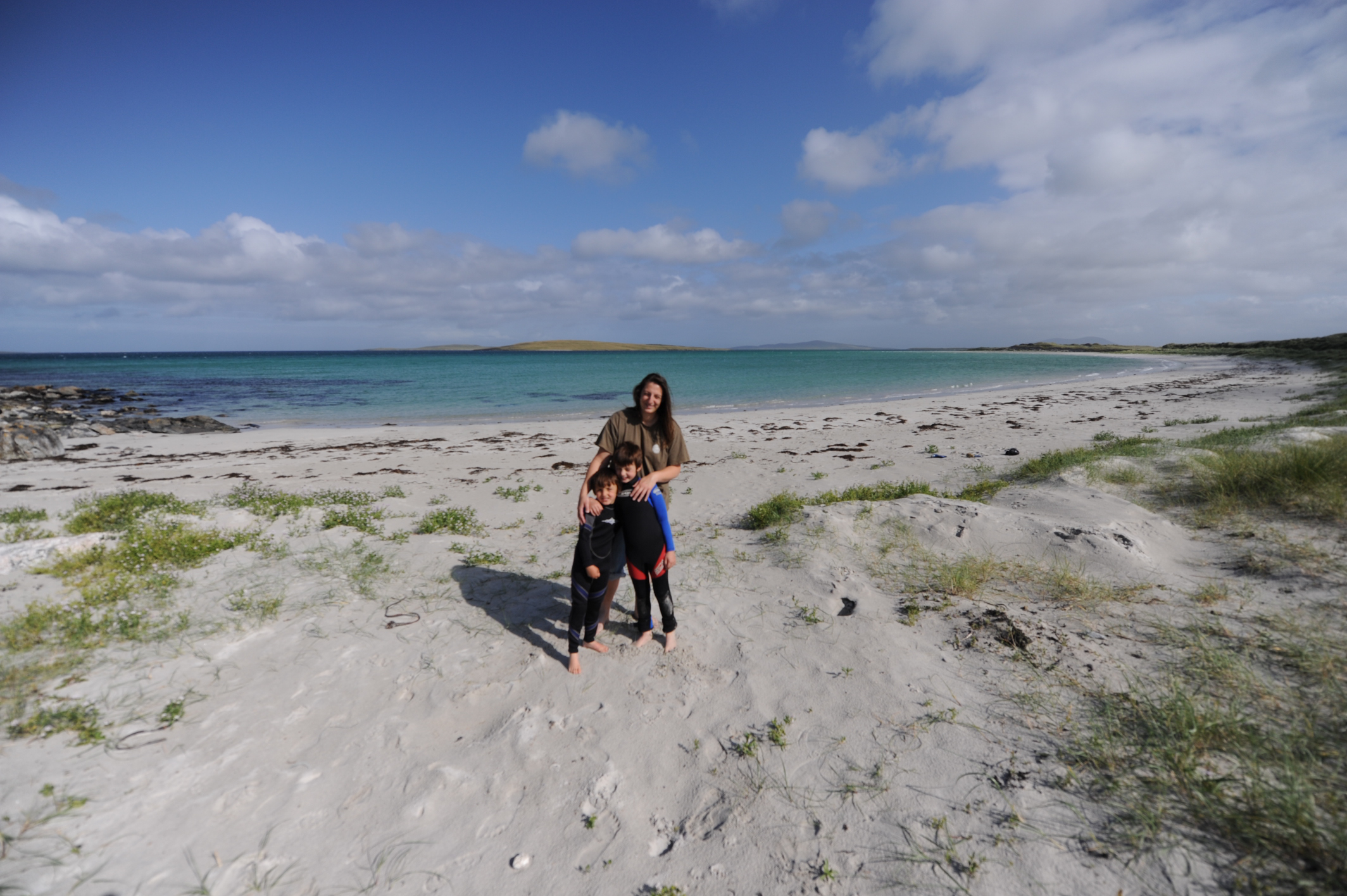 margaret soraya and children on the beach on the outer hebrides