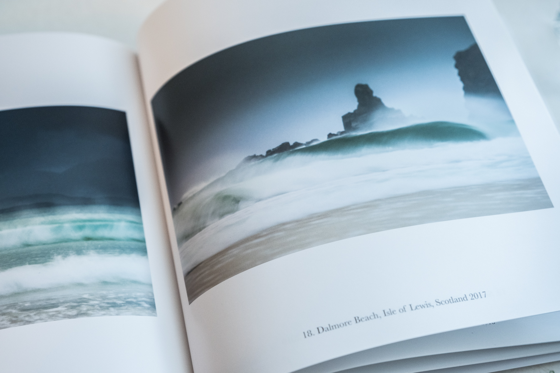 Inside spread of Quiet showing Dalmore Beach Isle of Lewis Scotland 2017 — atmospheric long exposure photograph of waves and sea stack in mist